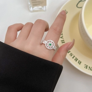 Lace woven silver ring with Hetian jade and crystals on a minimalist background