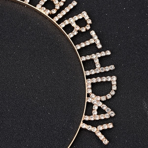 Elegant gold metal birthday crown headband featuring sparkling crystal rhinestone lettering