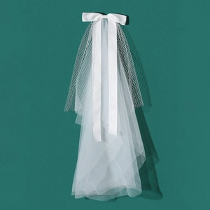 Elegant white bridal veil with satin butterfly bow and layered mesh for wedding photography