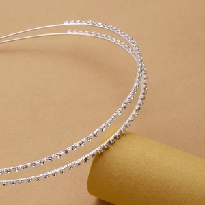 Elegant double-layer silver headband with two rows of sparkling white rhinestones