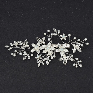 Bridal hair clip with silver leaves, white pearls and blue crystals for wedding hair styling
