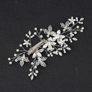 Silver bridal hair clip with white pearls, crystals, and hollow leaf vine design