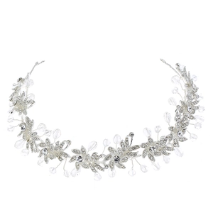 Elegant silver bridal headband with crystal flowers and leaves for wedding hair styling