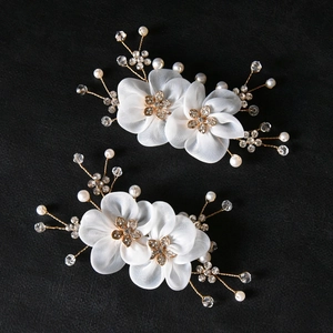 Elegant pearl bridal shoe clips with handmade white gauze petals and gold floral rhinestones