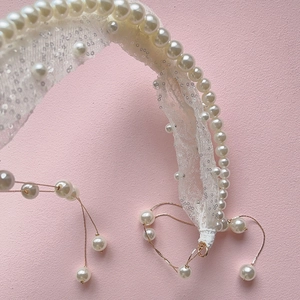 Elegant bridal pearl headband with sequins, lace, and hanging tassels for weddings
