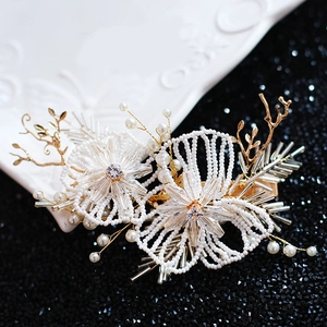 Exquisite bridal hair clip with ivory pearls and champagne gold floral beadwork accents