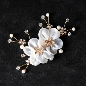 Elegant bridal hair piece with white gauze flowers, pearls, and crystals on gold wire