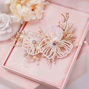 Handmade bridal hair comb with white pearl flowers and gold wire in a pink velvet gift box