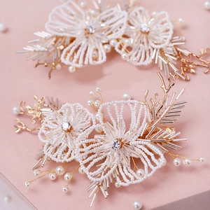 Elegant bridal pearl flower hair clips with sparkling rhinestones and golden branches