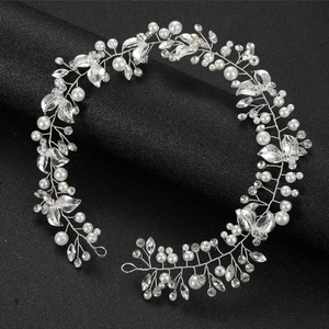 Silver bridal hair vine with white pearls and sparkling rhinestone leaves for wedding