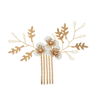 Elegant bridal hair comb with gold leaves and white resin flowers for weddings