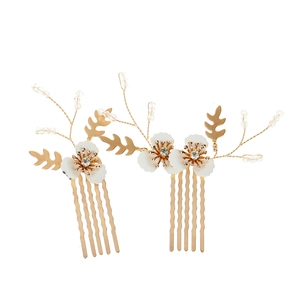 Elegant gold bridal hair comb set with white flowers and crystal leaf branches on white back