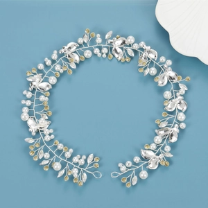 Silver bridal hair vine with handmade twisted wire, white pearls, and rhinestone leaf details