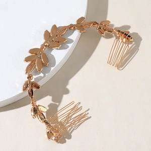 Golden bridal hair accessory with leaf design and dual combs for wedding styling