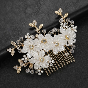 Elegant bridal hair comb with white bead flowers and golden leaves on black leather