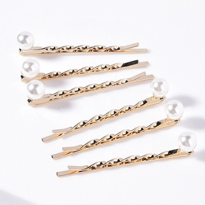 Elegant set of six golden spiral hair pins with white pearls for bridal and daily wear