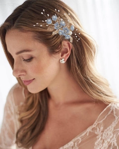 Blue fabric flower hair comb and pearl earrings set worn by a model for weddings