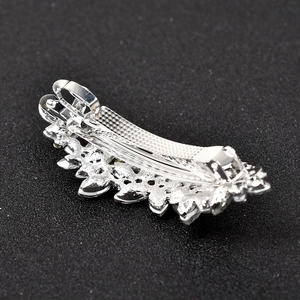 Detail view of silver spring hair clip showing secure metal closure and marquise rhinestones