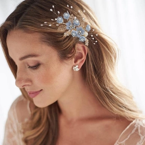 Floral hair comb set with blue fabric flowers, pearls, and crystals for bridal hairstyles
