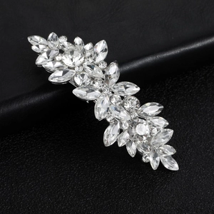 Elegant marquise crystal leaf hair clip with silver alloy finish on black leather background