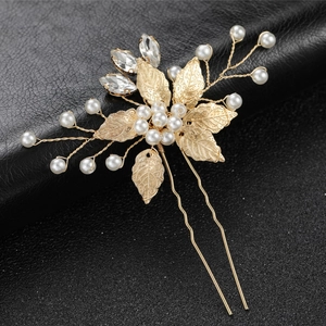 Golden bridal hair pin with delicate metal leaves, white pearls and sparkling crystals
