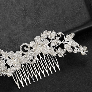 Elegant silver bridal hair comb with flower leaf design and crystal rhinestones