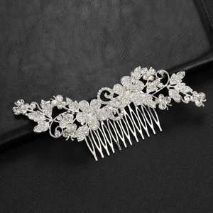 Elegant silver bridal hair comb with crystal flowers and leaves on black background