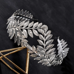 Baroque silver leaf crown headband with detailed natural vein patterns on black fabric