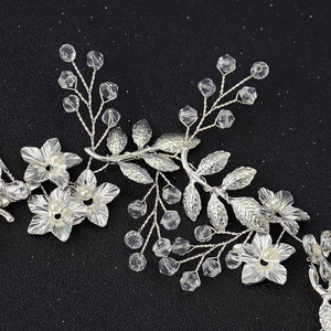 Silver bridal hairband with metal leaves, white pearls, and faceted crystal beads decoration