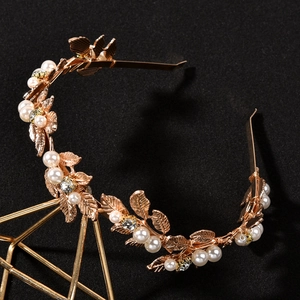 Detail of baroque gold leaf bridal headband with white pearls and sparkling rhinestones