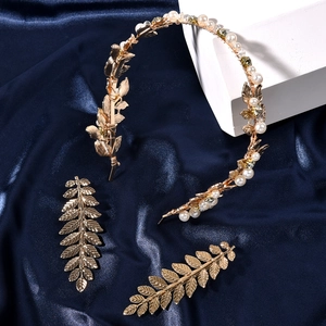 Baroque bridal hair accessories set featuring gold leaf headband and pearl hair clips