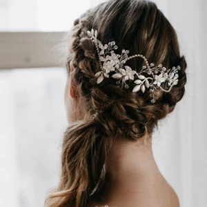 Elegant bridal hair vine with silver leaves, white flowers and crystals for wedding updos