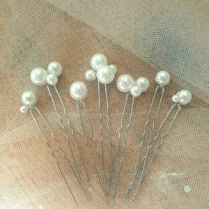 Elegant set of 7 pearl bridal hair pins with silver wire wrapping on U-shaped metal pins