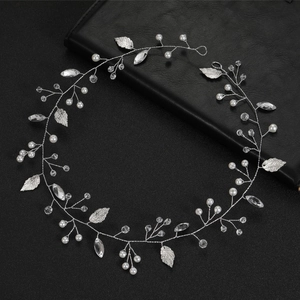Elegant silver leaf bridal hair vine with white pearls and sparkling crystal stones