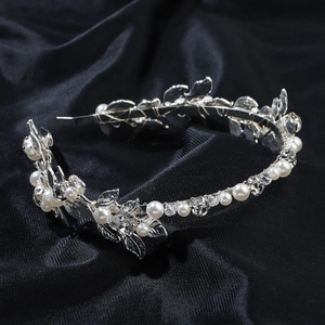 Elegant bridal hair hoop with silver metal leaves, pearls and crystals on black satin