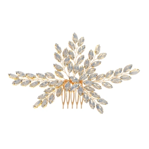 Detail of handcrafted gold hair comb with marquise cut stones for bridal hairstyles