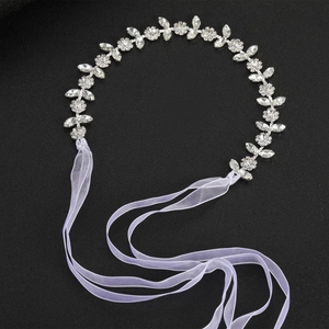 Elegant bridal rhinestone headband with silver leaf design and light purple ribbons