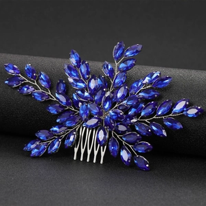 Macro detail of royal blue crystal marquise stones on a silver bridal hair comb