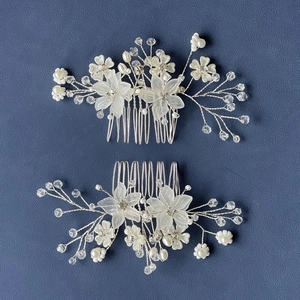Silver bridal flower hair combs set with frosted petals, crystal beads and white pearls
