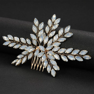 Golden bridal hair comb featuring white opal marquise stones in a floral leaf design
