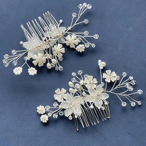 Elegant set of two white floral hair combs with pearls and crystals for bridal styling