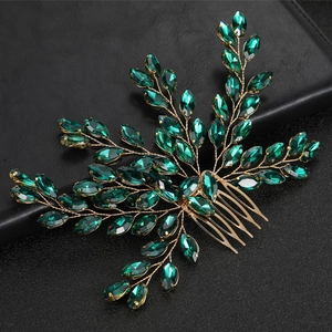 Elegant silver hair comb with royal blue rhinestones in a floral leaf pattern