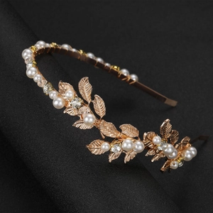 Golden baroque leaf bridal headband with white pearls and sparkling rhinestones