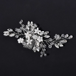Detailed view of handmade bridal hair comb with pearls and clear crystal flowers