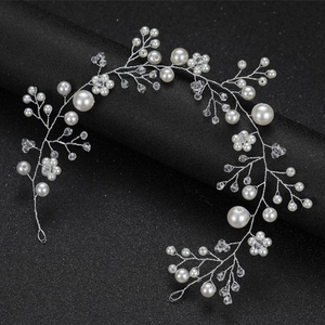 Handmade bridal hair vine with white pearls and crystals on a silver wire base