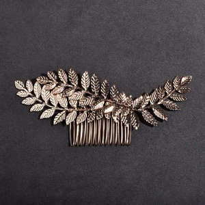 Golden three-leaf bridal hair comb with detailed veins and ten-tooth metal clip