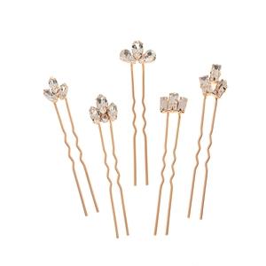 Five-piece set of rose gold bridal hair pins with marquise cut rhinestones on white background