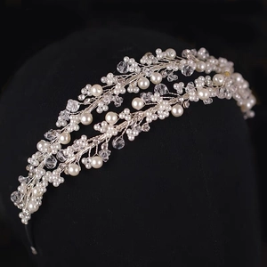 Detail of bridal headband with double rows of pearls and crystals on silver wire