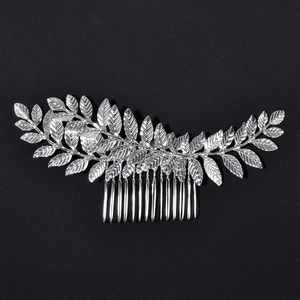 Detail view of silver leaf bridal hair comb with textured foliage and fine metal teeth