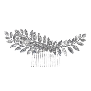Macro shot of silver metal leaf hair comb with textured veins and twelve-teeth insert